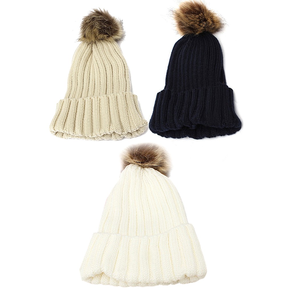 cap with fur ball on top
