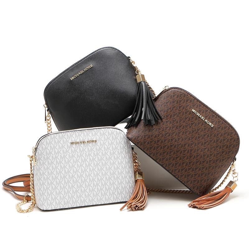 price of michael kors sling bag