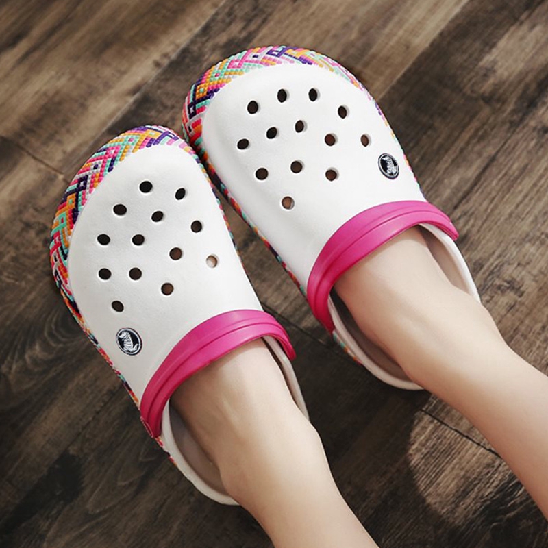 white crocs with rainbow words