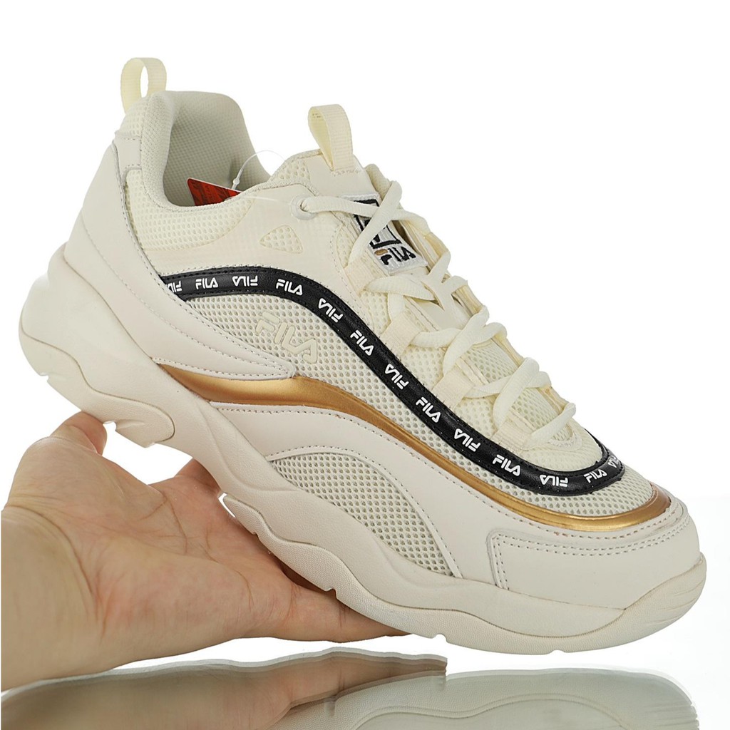 white and gold fila