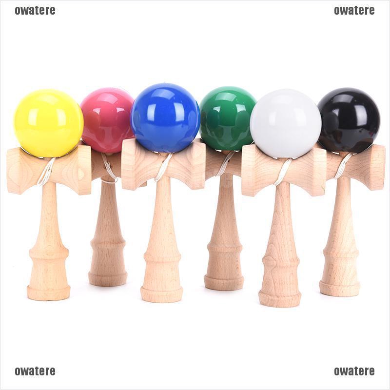 wooden toy with ball and string