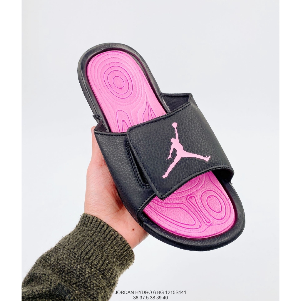 pink and black nike flip flops