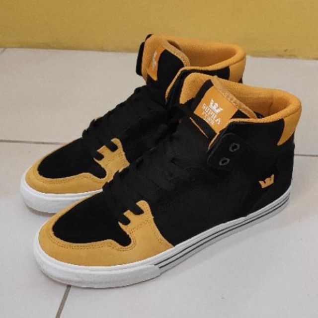 black and gold skate shoes