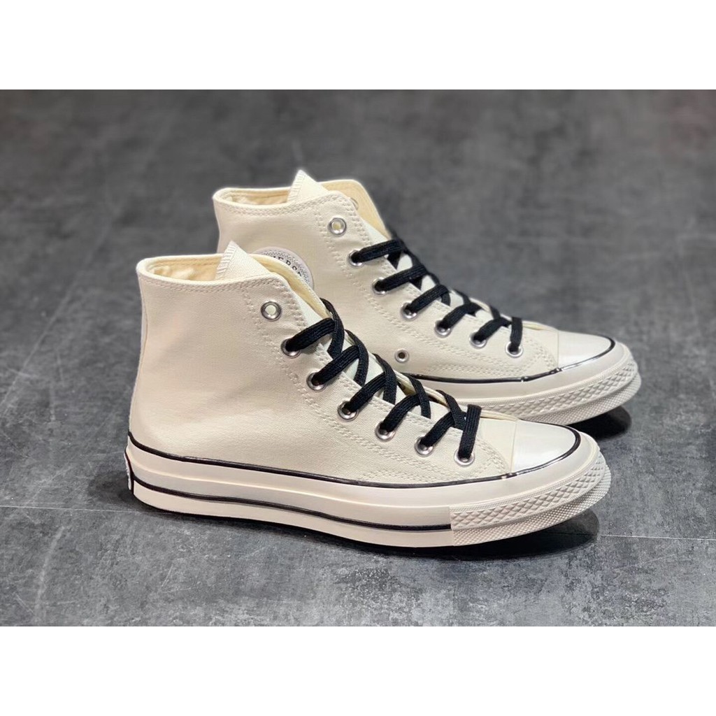 white high top converse with black line