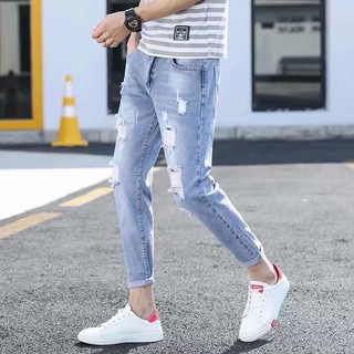 folded ripped jeans