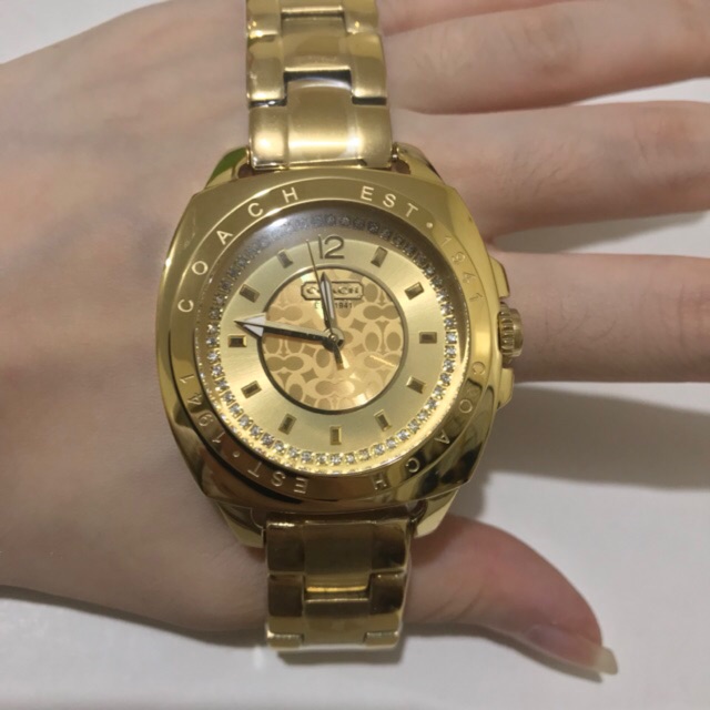 coach gold watch