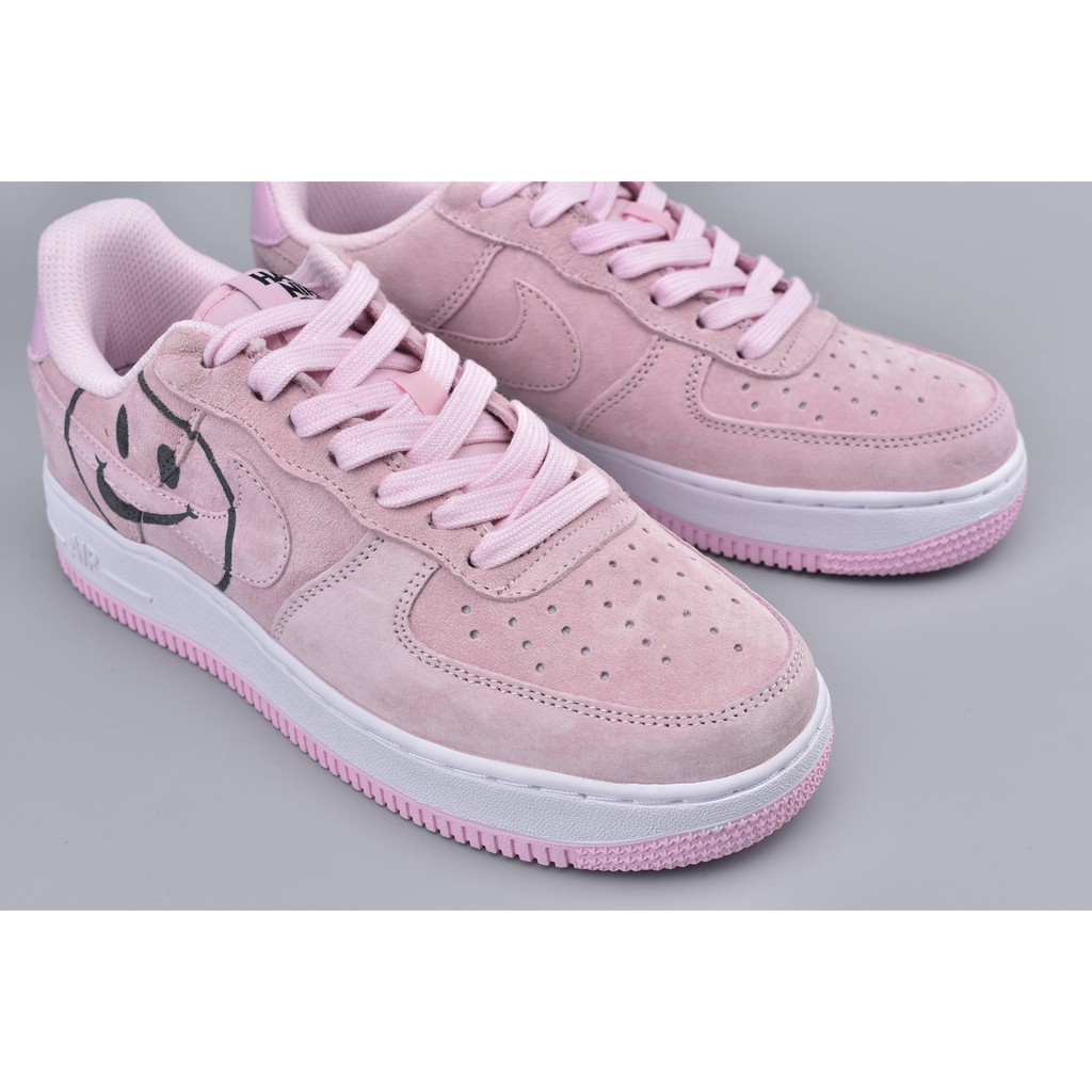 pink air forces with smiley face