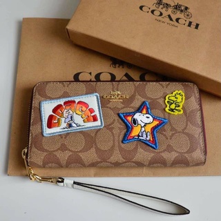 Coach X Peanuts Long Zip Around Wallet In Signature Canvas With Varsity 