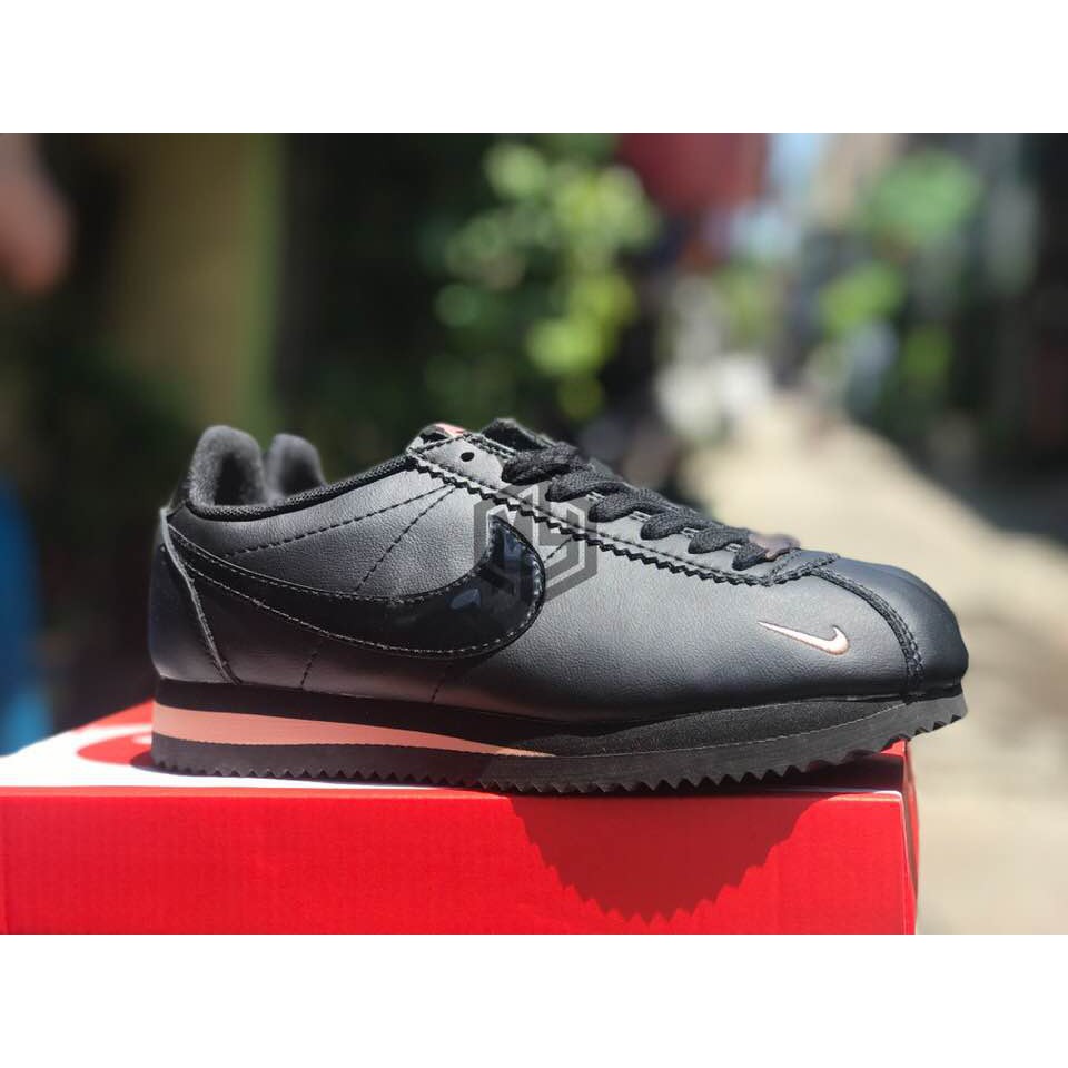 black and rose gold nike cortez