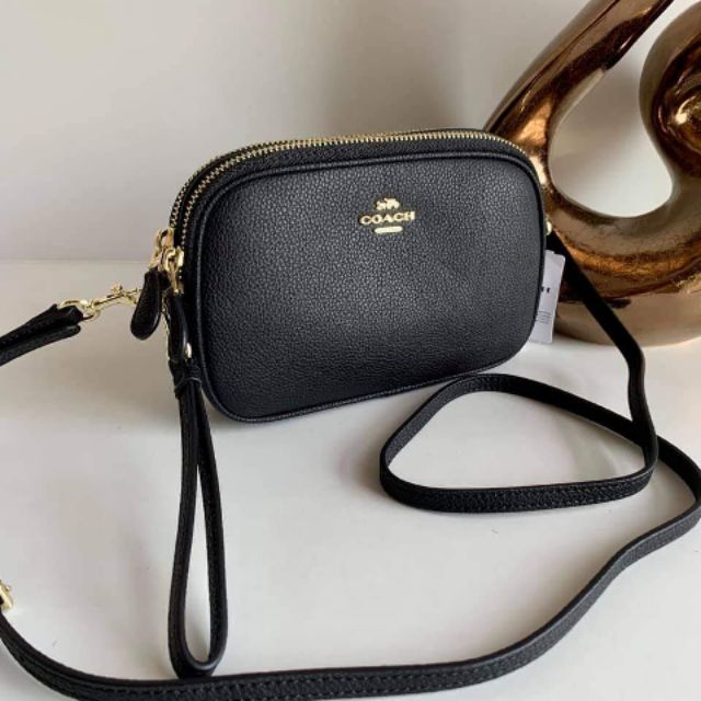 coach crossbody clutch in pebble leather