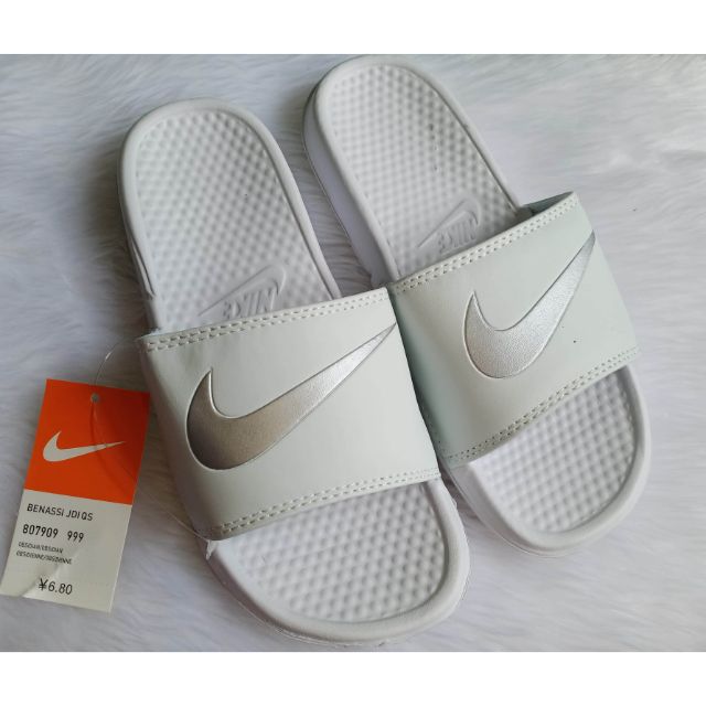 white nikes slides