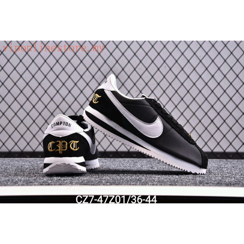 gold nike slippers