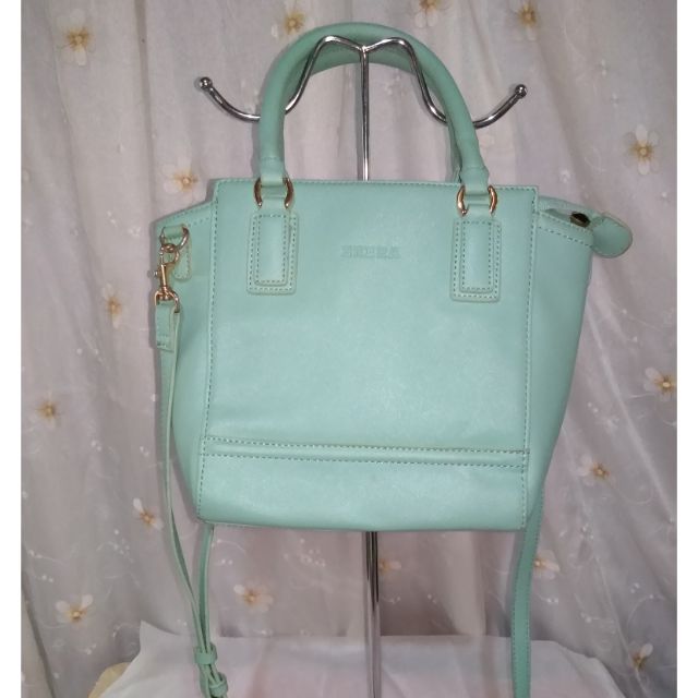 mint green luggage