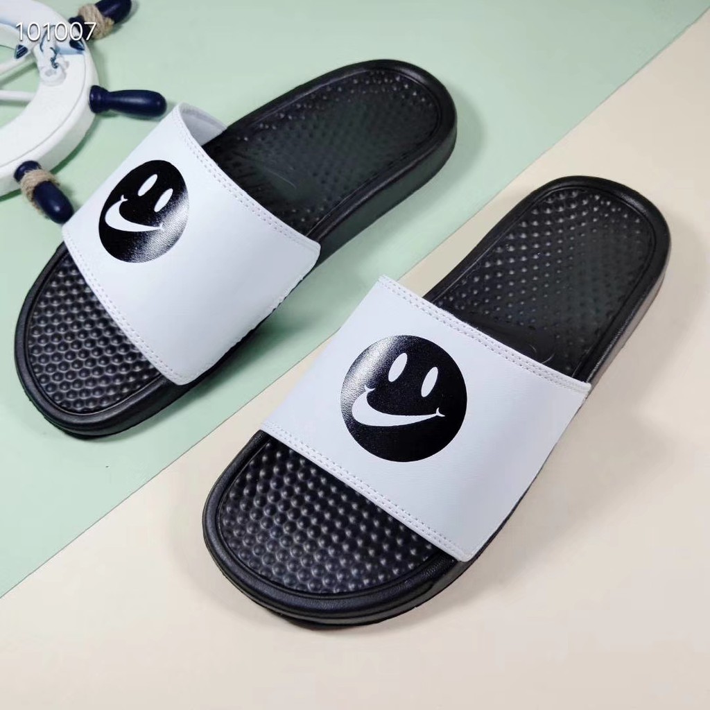 smiley face nike slides