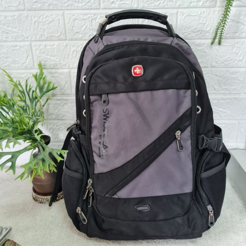 A large Swissgear backpack with multiple compartments, complete in one
