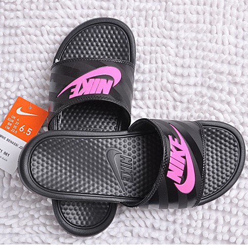 black and pink nike sliders