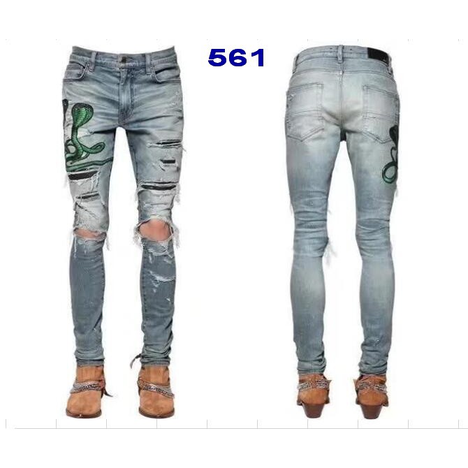 amiri jeans with green snake