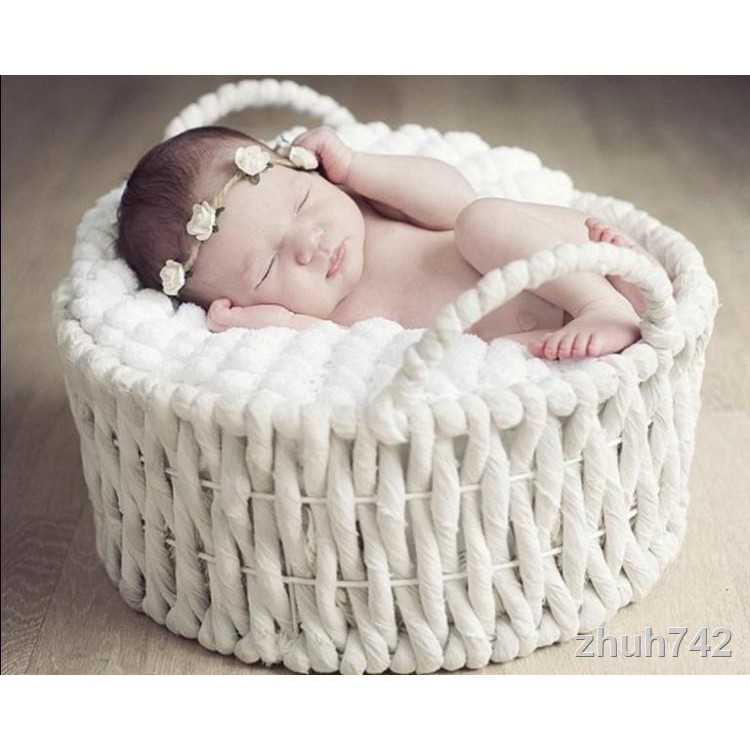 newborn baby in basket