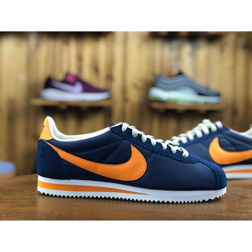 navy blue cortez shoes