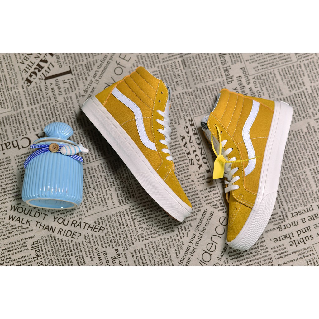 yellow and white vans