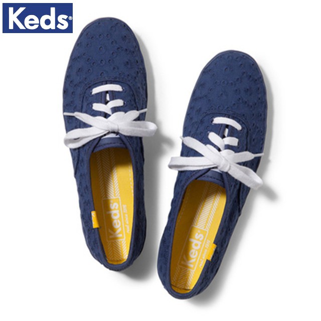 grey keds with yellow laces