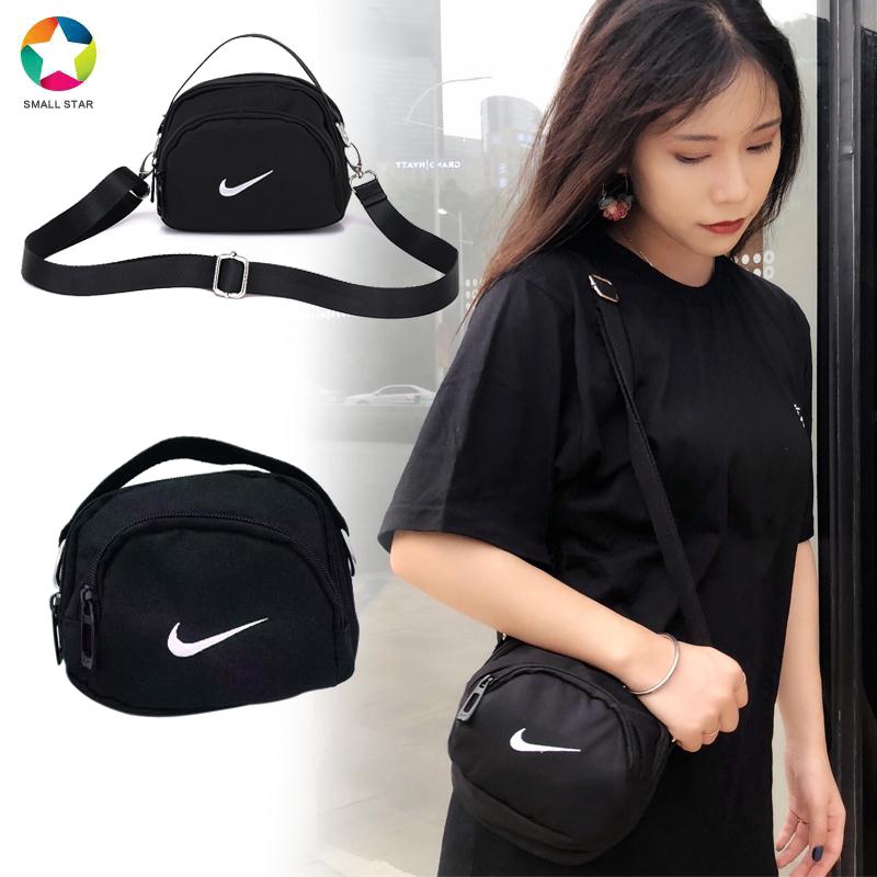 nike mini swoosh pvc sling bag