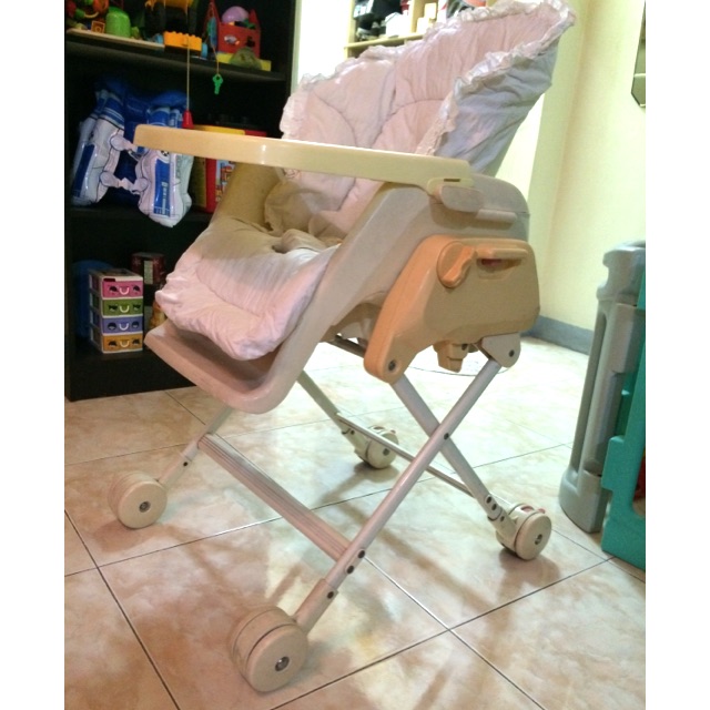 baby rocking in high chair