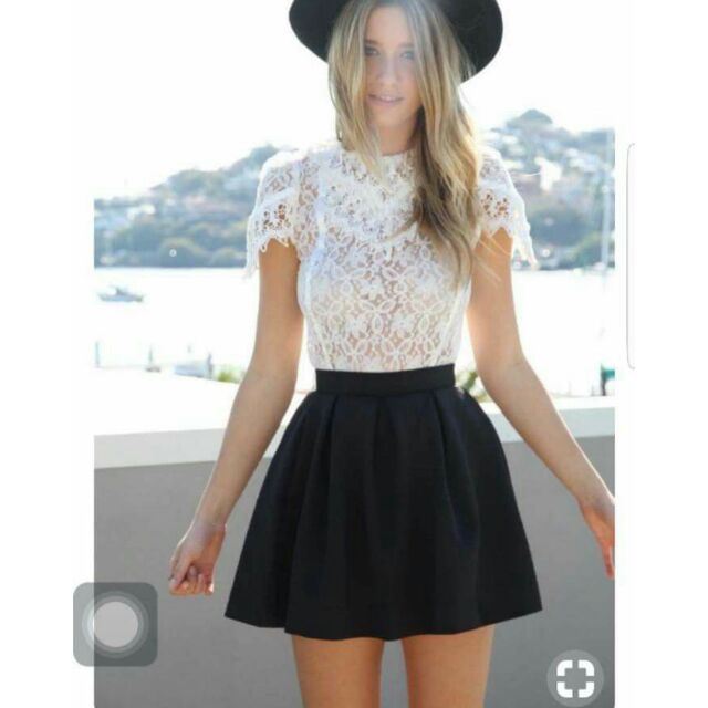 black crop top with black skirt
