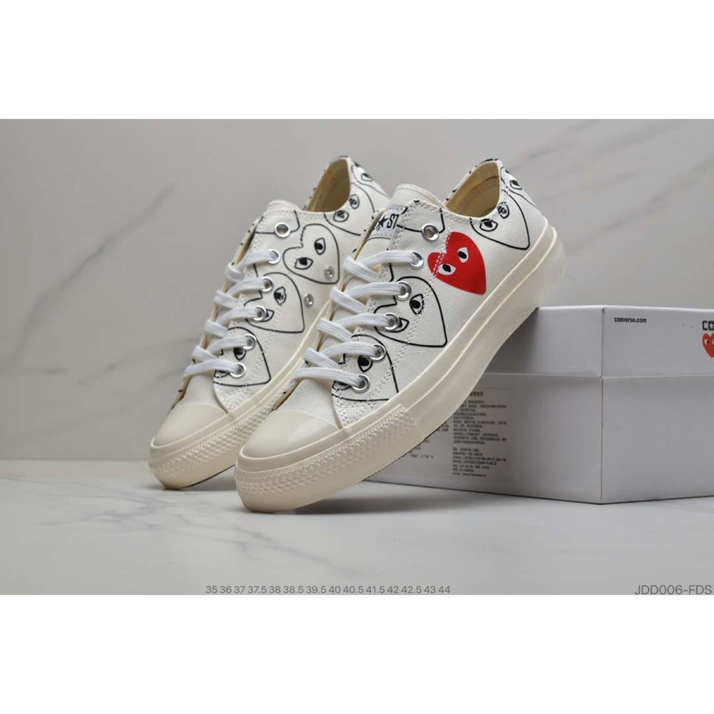 converse with red heart on side