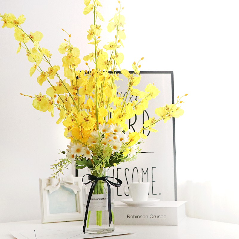 yellow artificial flowers in vase