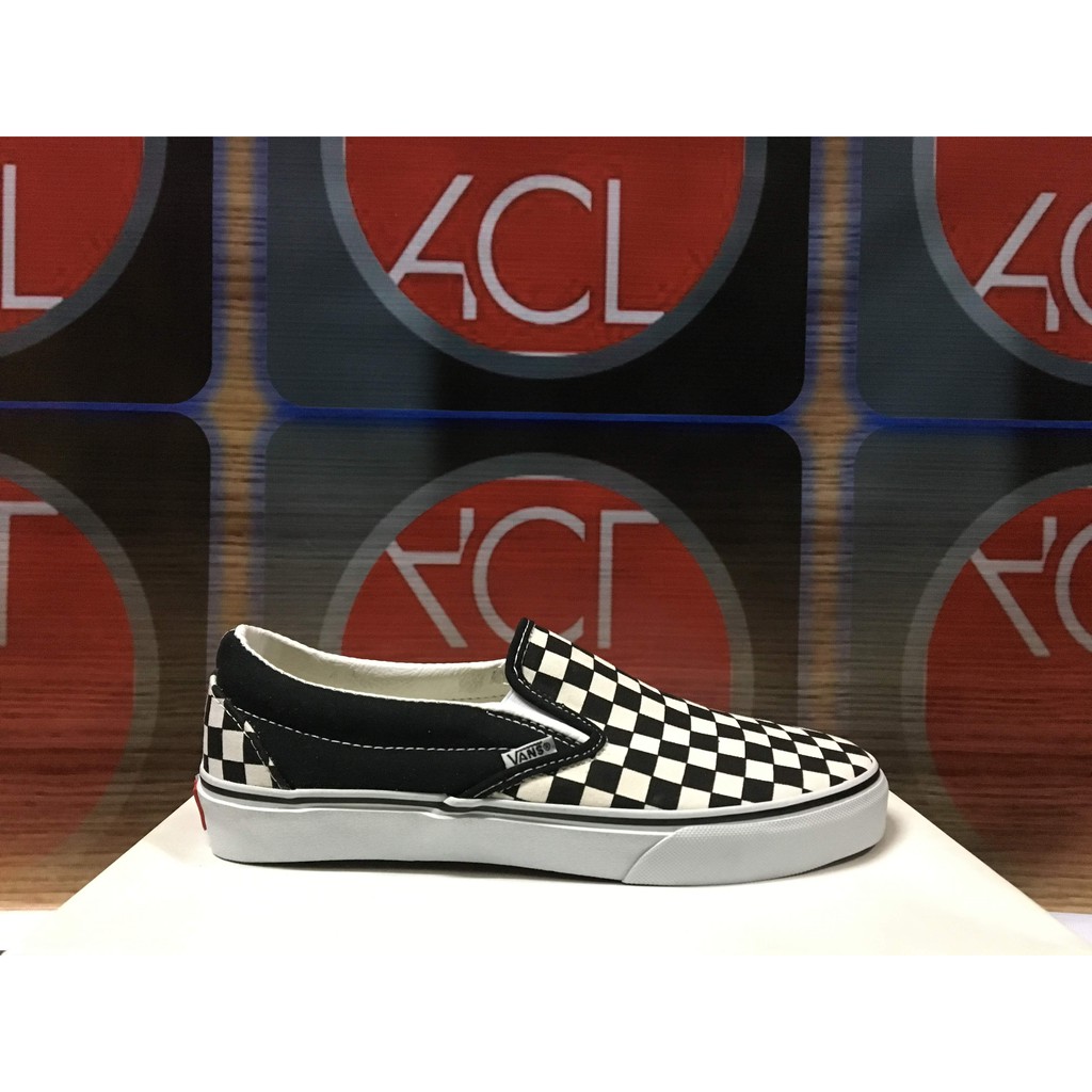 checkered black vans slip on