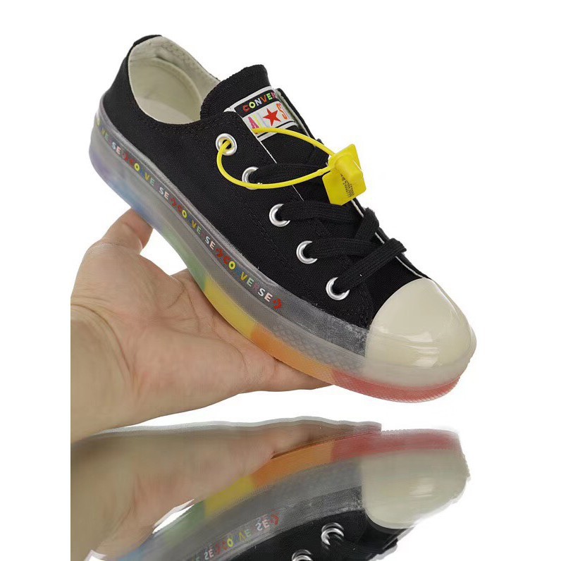 black converse with rainbow bottom