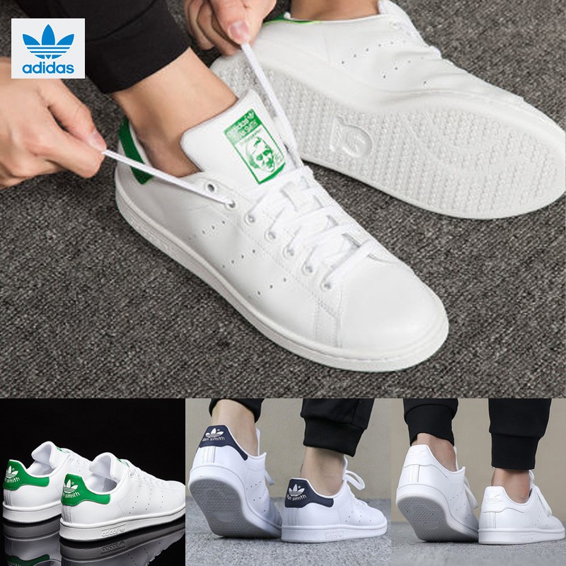 all white adidas with green