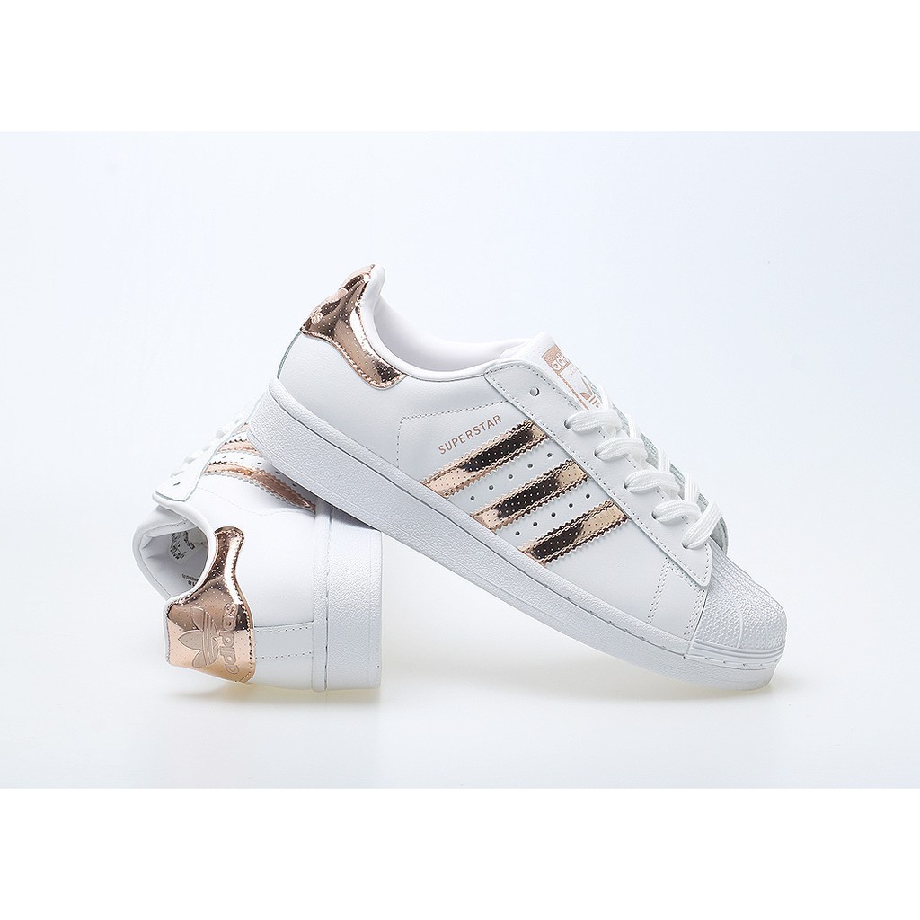 white and rose gold adidas