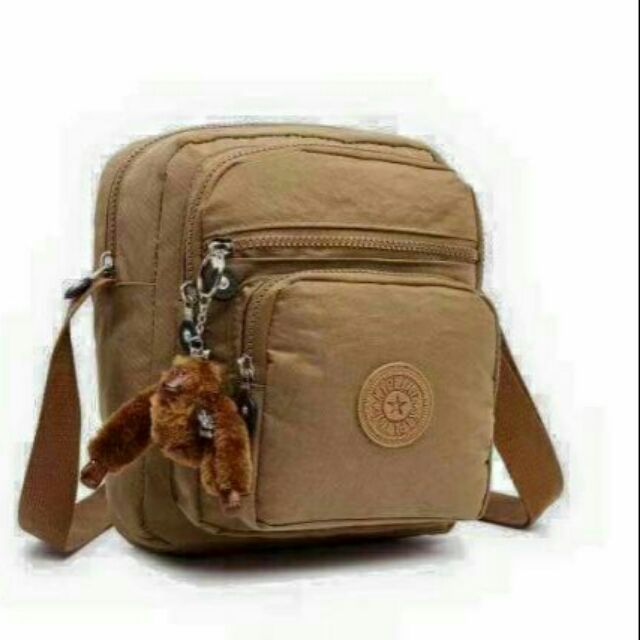 kipling sling bag original vs fake
