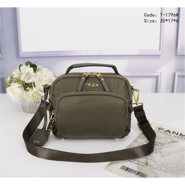 tumi sling bag ladies