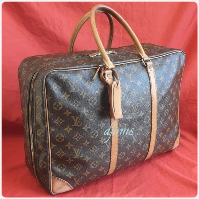 monogram carry on suitcase