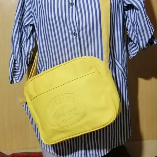 lacoste yellow sling bag