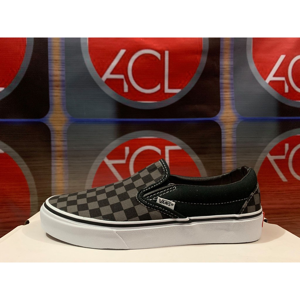 gray and black slip on vans