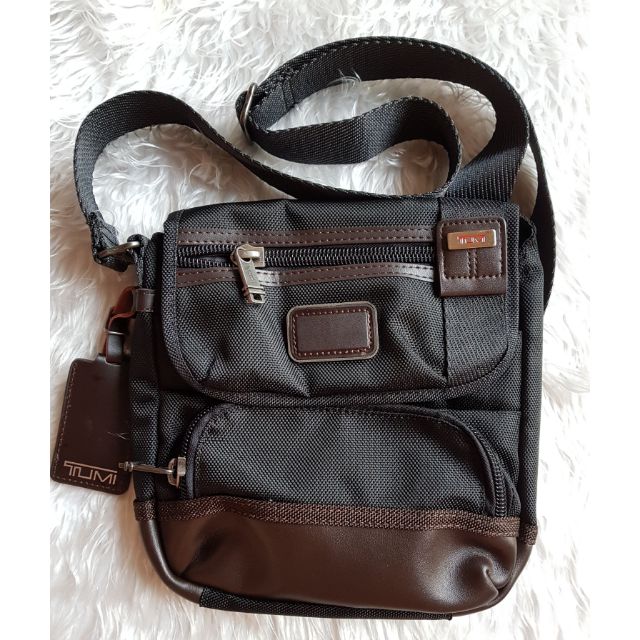 tumi leather sling bag