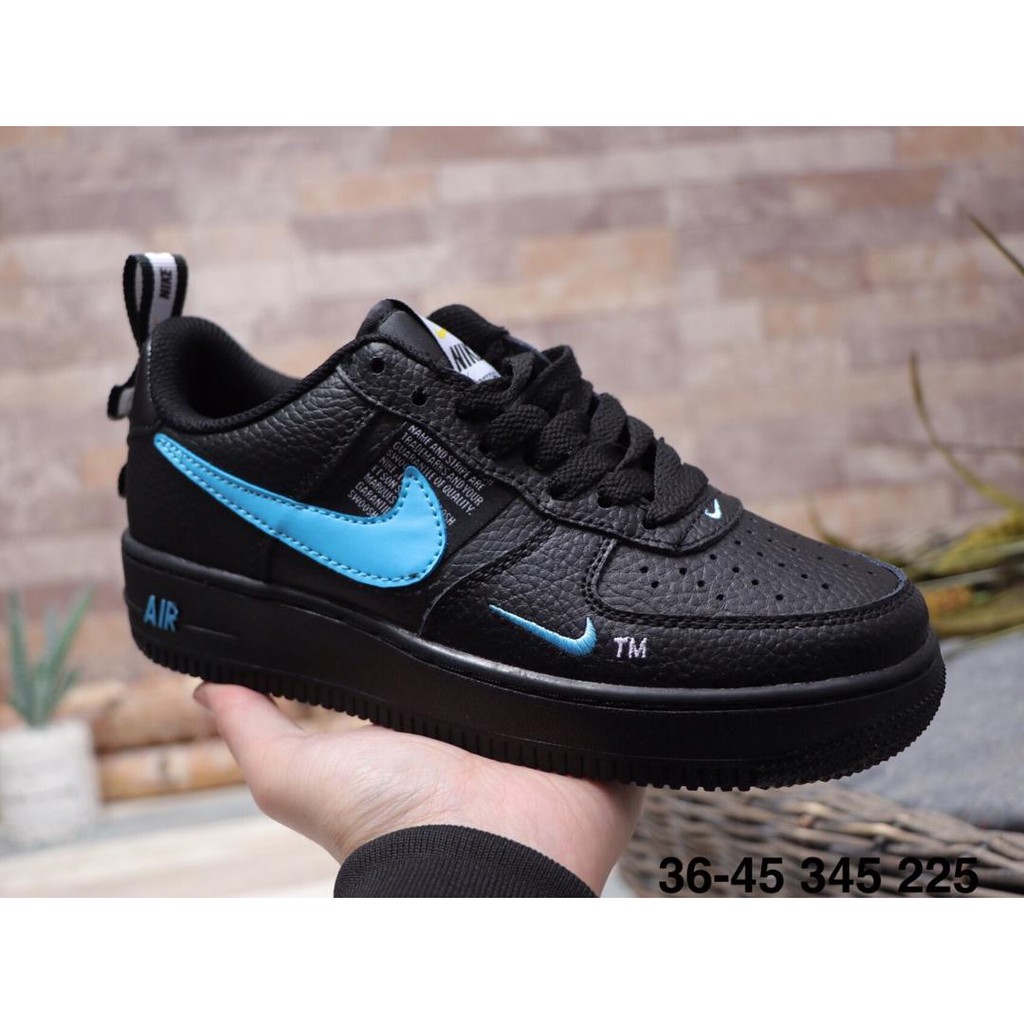 nike air force 1 black with blue swoosh