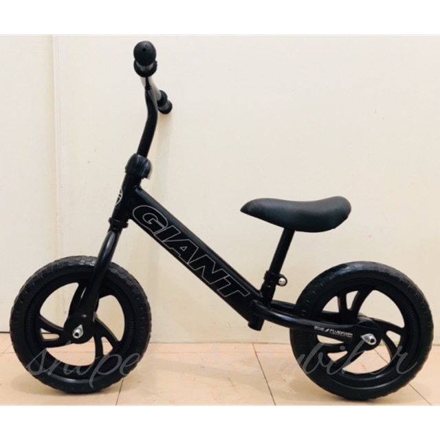 riding a strider bike