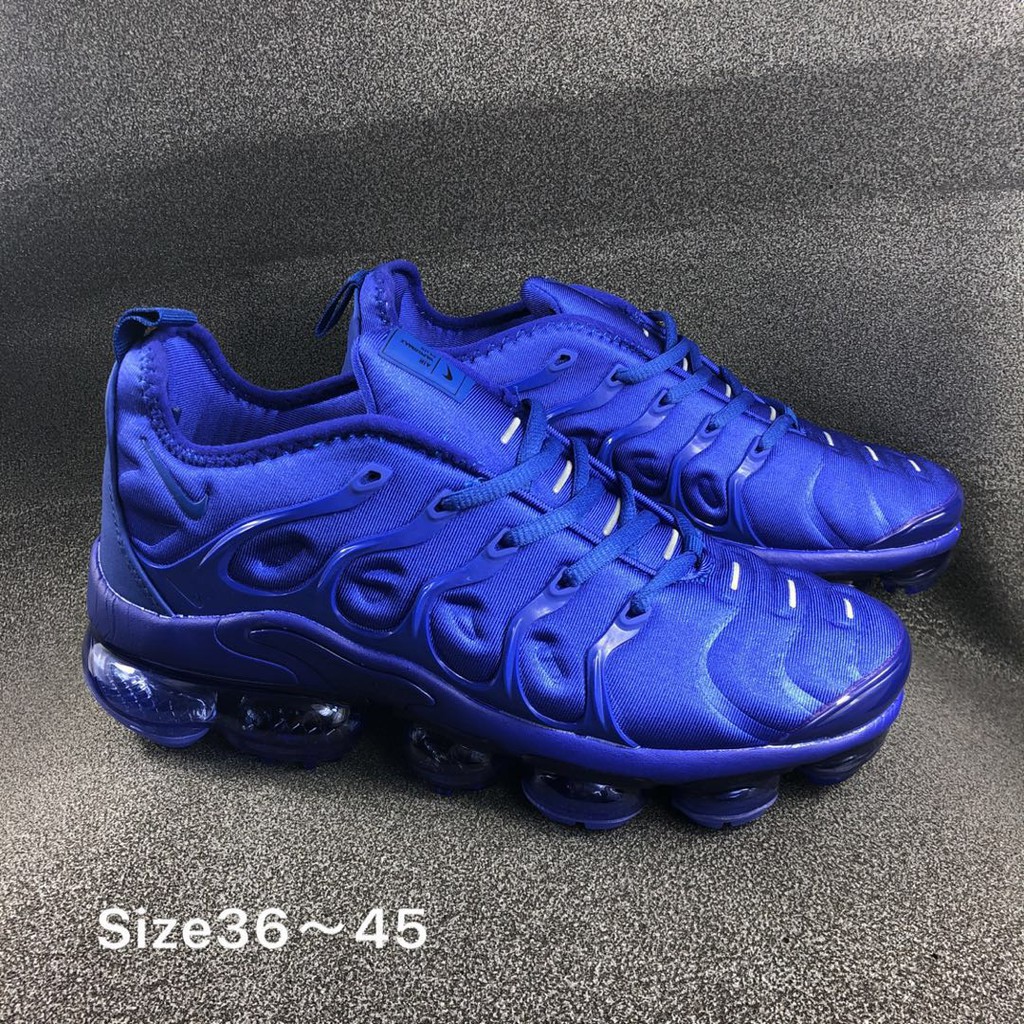 green and blue vapormax plus