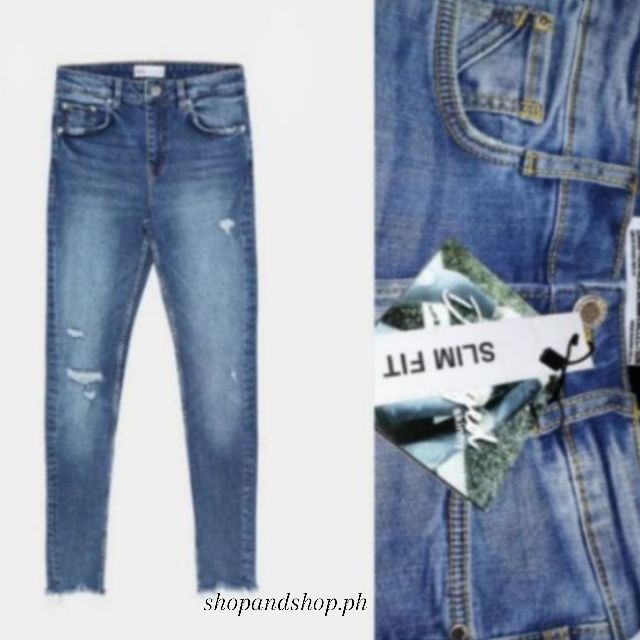 skinny mid waist destroyed jeans