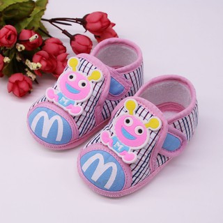 pink and blue baby shoes