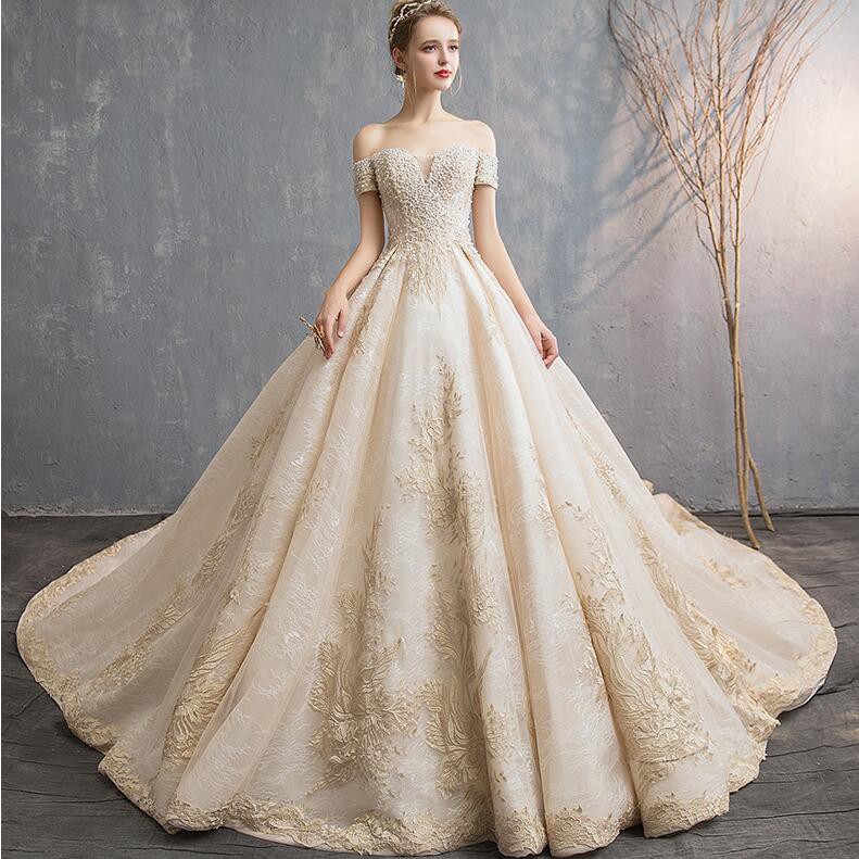 champagne off the shoulder wedding dress