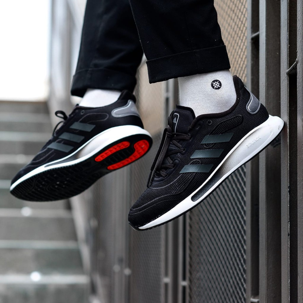 black sneaker with black sole
