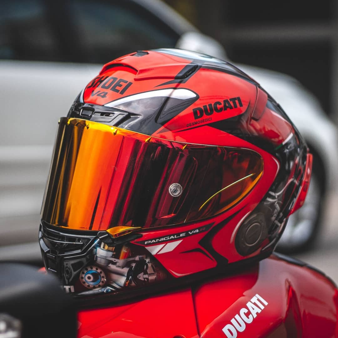 red and black motocross helmet