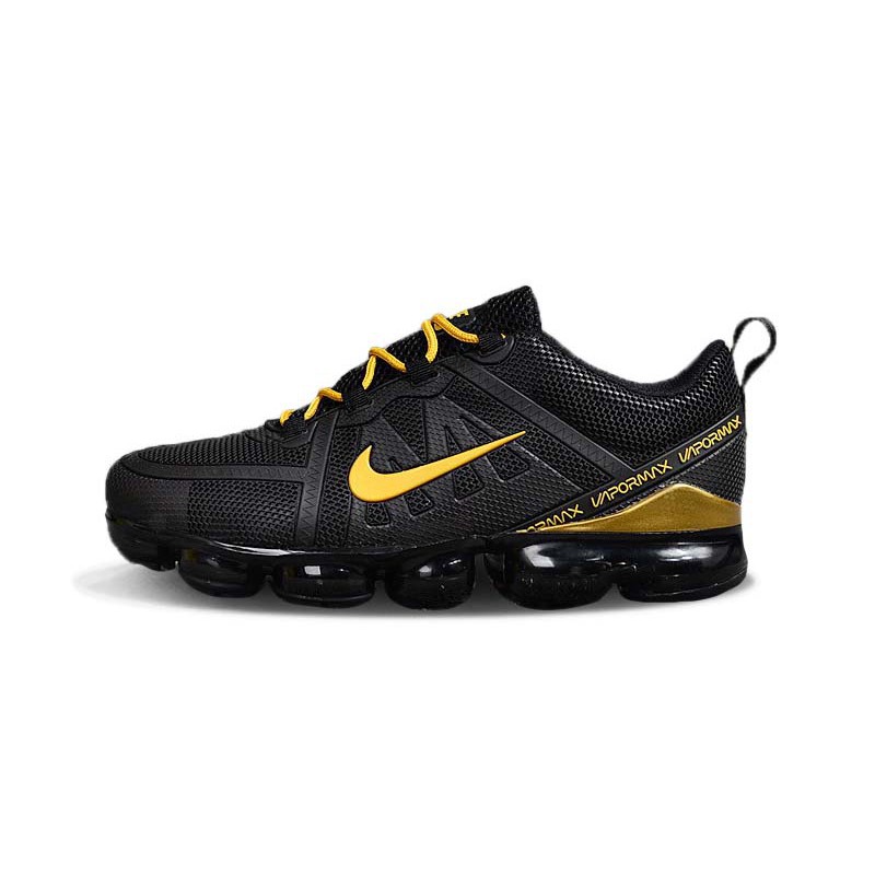 gold black nike shoes