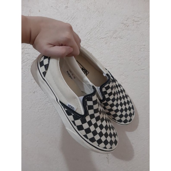 vans checkerboard slip on sizing